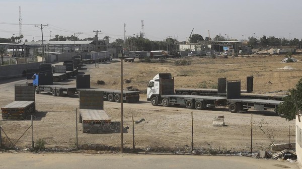 Trucks with humanitarian aid enter the Gaza Strip in Rafah on Saturday, Oct. 21, 2023. (AP Photo/Hatem Ali)