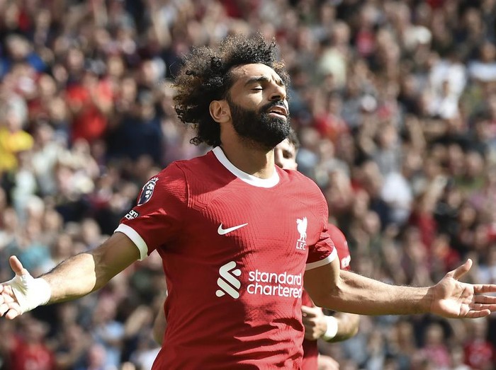 Liverpool's Mohamed Salah celebrates after scoring his sides second goal during the Premier League soccer match between Liverpool and AFC Bournemouth at Anfield, in Liverpool, England, Saturday, Aug. 19, 2023. (AP Photo/Rui Vieira)