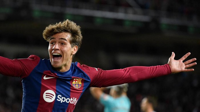 Marc Guiu Barcelona's Spanish forward #38 Marc Guiu celebrates after scoring his team's first goal during the Spanish league football match between FC Barcelona and Athletic Club Bilbao at the Estadi Olimpic Lluis Companys in Barcelona on October 22, 2023. (Photo by Josep LAGO / AFP)