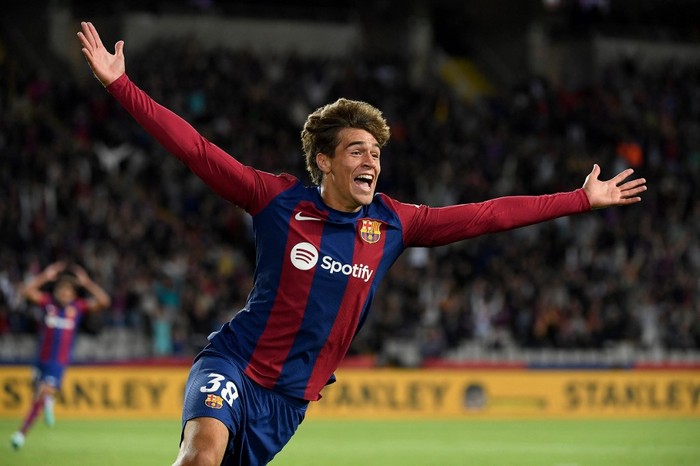 Barcelonas Spanish forward #38 Marc Guiu celebrates after scoring his teams first goal during the Spanish league football match between FC Barcelona and Athletic Club Bilbao at the Estadi Olimpic Lluis Companys in Barcelona on October 22, 2023. (Photo by Josep LAGO / AFP)