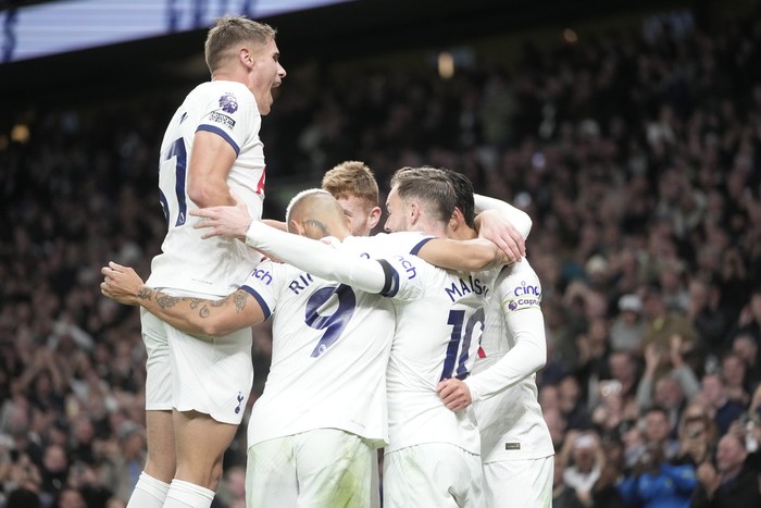 Britain Soccer Premier League Tottenham players celebrate after Tottenham's James Maddison scored his side's second goal during the English Premier League soccer match between Tottenham Hotspur and Fulham at the Tottenham Hotspur Stadium in London, Monday, Oct. 23, 2023. (AP Photo/Kin Cheung)