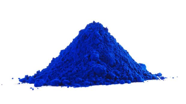Pile of blue powder isolated on white