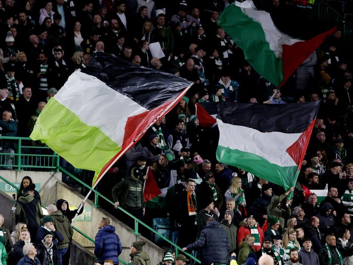 Soccer Football - Champions League - Group E - Celtic v Atletico Madrid - Celtic Park, Glasgow, Scotland, Britain - October 25, 2023 Celtic fans wave Palestinian flags in support of Palestine amid the ongoing conflict between Israel and the Palestinian Islamist group Hamas before the match Action Images via Reuters/Jason Cairnduff