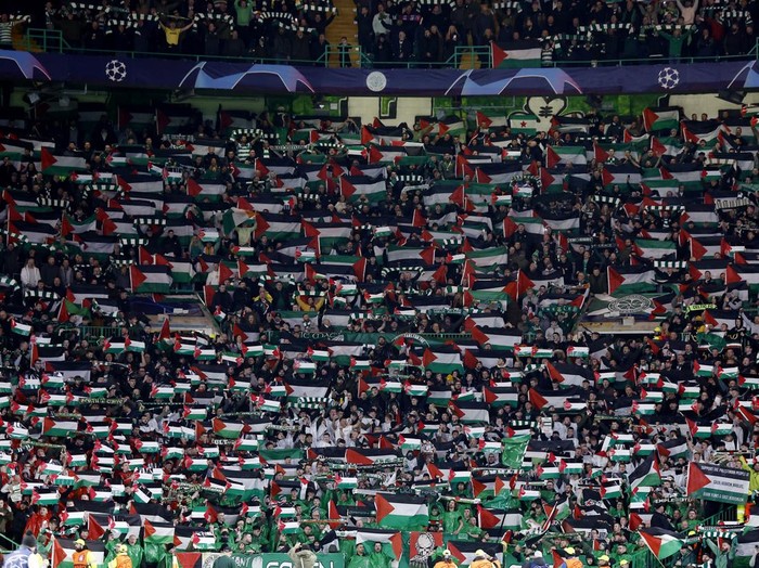 Soccer Football - Champions League - Group E - Celtic v Atletico Madrid - Celtic Park, Glasgow, Scotland, Britain - October 25, 2023 Celtic fans display Palestinian flags in support of Palestine amid the ongoing conflict between Israel and the Palestinian Islamist group Hamas before the match Action Images via Reuters/Jason Cairnduff