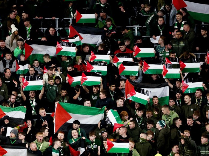 Soccer Football - Champions League - Group E - Celtic v Atletico Madrid - Celtic Park, Glasgow, Scotland, Britain - October 25, 2023 Celtic fans hold up Palestinian flags in support of Palestine amid the ongoing conflict between Israel and the Palestinian Islamist group Hamas before the match REUTERS/Russell Cheyne
