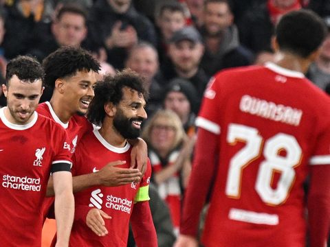 Liverpool's Egyptian striker #11 Mohamed Salah (C) celebrates scoring the team's fifth goal during the UEFA Europa League group E football match between Liverpool and Toulouse at Anfield in Liverpool, north west England on October 26, 2023. Liverpool won the match 5-1. (Photo by Oli SCARFF / AFP)