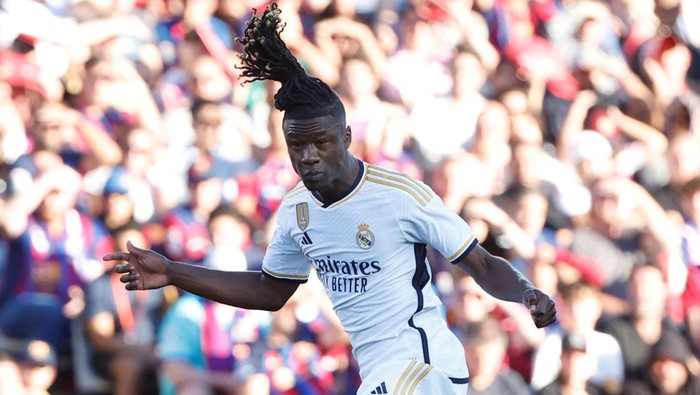 Real Madrids Eduardo Camavinga heads the ball ahead of Barcelonas Joao Cancelo during the La Liga soccer match between Barcelona and Real Madrid at the Olympic Stadium in Barcelona, Spain, Saturday, Oct. 28, 2023. (AP Photo/Joan Monfort)