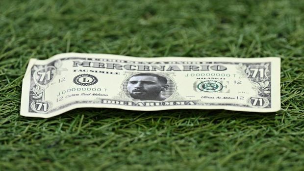 Soccer Football - Champions League - Group F - AC Milan v Paris St Germain - San Siro, Milan, Italy - November 7, 2023 General view as fake cash notes with former AC Milan player and Paris St Germain's Gianluigi Donnarumma's face on it are thrown by AC Milan fans in the stands REUTERS/Daniele Mascolo