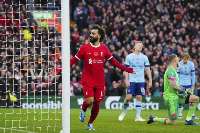 Liverpool's Mohamed Salah celebrates scoring his side's opening goal during the English Premier League soccer match between Liverpool and Brentford at Anfield stadium in Liverpool, England, Sunday, Nov. 12, 2023. (AP Photo/Jon Super)