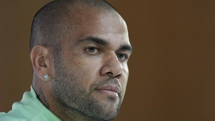 FILE - Brazils Dani Alves listens to a question during a press conference on the eve of the group G of World Cup soccer match between Brazil and Cameroon in Doha, Qatar, on Dec. 1, 2022. Alves will face trial for allegedly having sexually assaulted a woman in a night club last year, a Spanish judge ordered Tuesday Nov. 14, 2023. (AP Photo/Andre Penner, File)