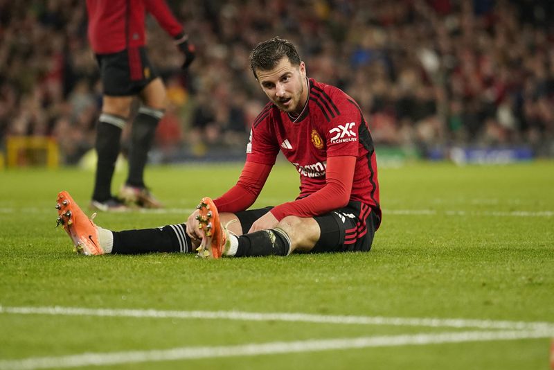 Manchester United's Mason Mount sits on the field during the Champions League group A soccer match between Manchester United and Galatasaray at the Old Trafford stadium in Manchester, England, Tuesday, Oct. 3, 2023. (AP Photo/Dave Thompson)