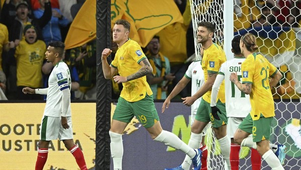 Harry Souttar of Australia, second left, reacts after scoring a goal during the FIFA World Cup 2026 Asian Qualifiers Round 1 soccer match between Australia and Bangladesh at AAMI Park in Melbourne, Australia, Thursday, Nov. 16, 2023. (James Ross/AAP Image via AP)