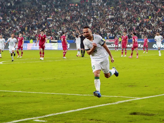 Iraq's Osama Rashid celebrates scoring his team's third goal during the 2026 FIFA World Cup AFC qualifiers football match between Iraq and Indonesia at the Basra International Stadium, in Basra, Iraq, Thursday, Nov.16, 2023. (AP Photo/Nabil al-Jourani)