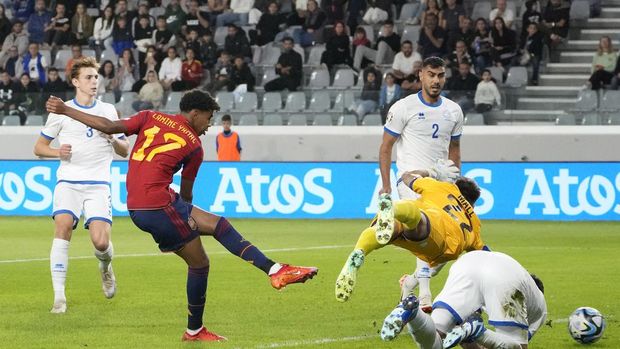 Spain's Lamine Yamal scores his sides first goal during an Euro 2024 group A qualifying soccer match between Cyprus and Spain, at the Alphamega Stadium stadium in Limassol, Cyprus Thursday, Nov. 16, 2023. (AP Photo/Petros Karadjias)