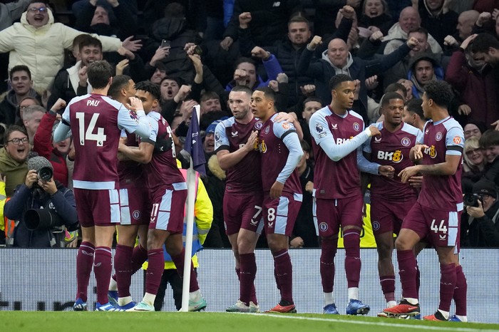 Britain Soccer Premier League Aston Villa players celebrate after Ollie Watkins scored their second goal during the English Premier League soccer match between Tottenham Hotspur and Aston Villa at the Tottenham Hotspur stadium in London, Sunday, Nov. 26, 2023. (AP Photo/Kirsty Wigglesworth)