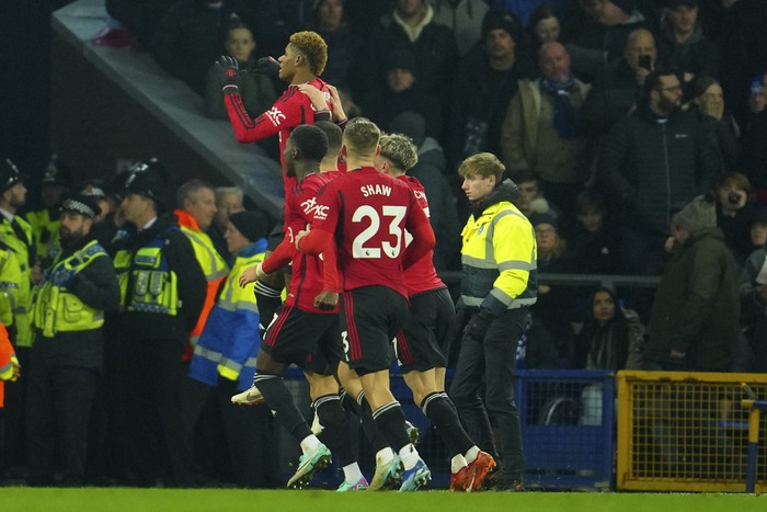 Manchester Uniteds Marcus Rashford celebrates after scoring his sides second goal on a penalty kick during the English Premier League soccer match between Everton and Manchester United, at Goodison Park Stadium, in Liverpool, England, Sunday , Nov. 26, 2023. (AP Photo/Jon Super)