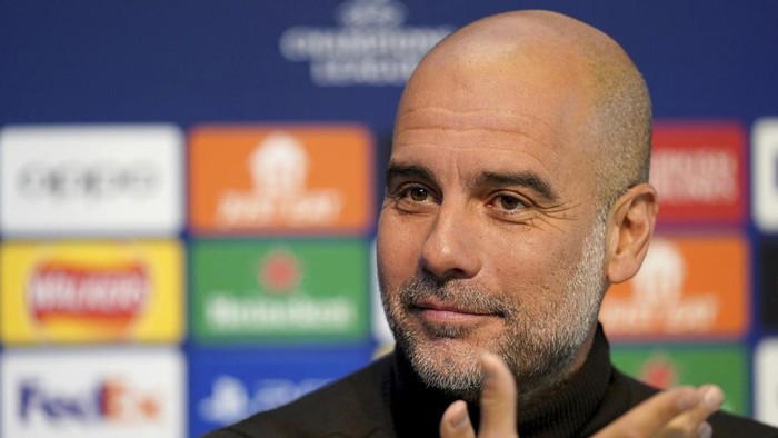 Manchester City manager Pep Guardiola reacts during a press conference at the City Football Academy in Manchester, England, Monday Nov. 27, 2023, ahead of their Champions League match vs Leipzig. (Martin Rickett/PA via AP)