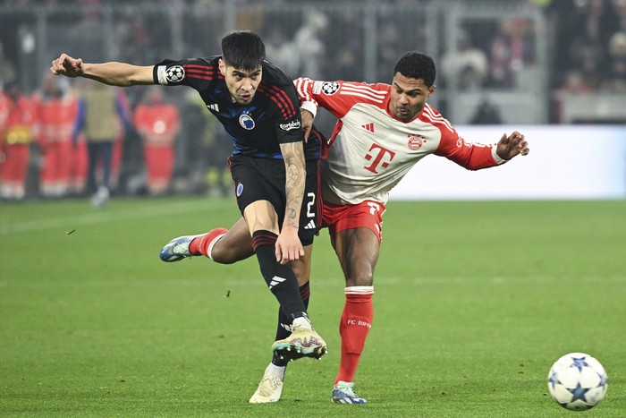Copenhagens Kevin Diks, left, and Munichs Serge Gnabry battlef for the ball during the Champions League Group A soccer match between Bayern Munich and FC Copenhagen at Allianz Arena, Munich, Germany, Wednesday Nov. 29, 2023. (Sven Hoppe/dpa via AP)