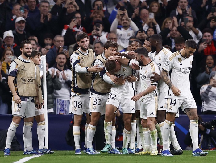 Soccer Football - Champions League - Group C - Real Madrid v Napoli - Santiago Bernabeu, Madrid, Spain - November 29, 2023  Real Madrid's Nico Paz celebrates scoring their third goal with teammates REUTERS/Juan Medina