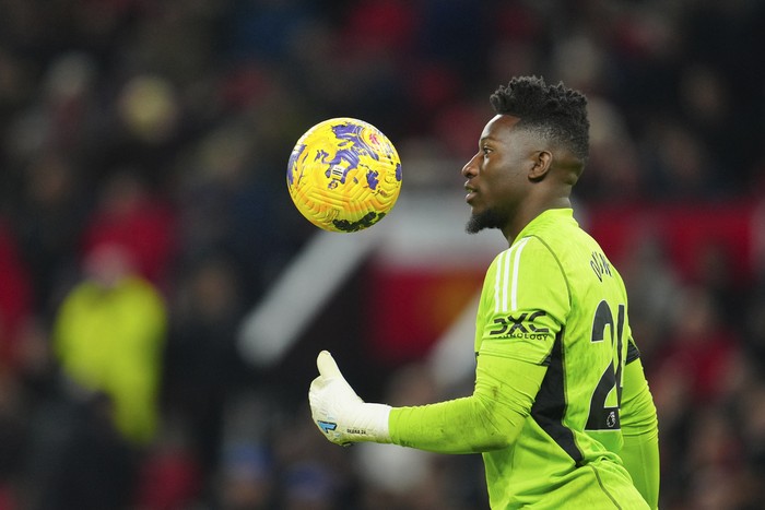 Manchester United's goalkeeper Andre Onana during the English Premier League soccer match between Manchester United and Luton Town at the Old Trafford stadium in Manchester, England, Saturday, Nov. 11, 2023. (AP Photo/Jon Super)