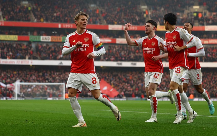Soccer Football - Premier League - Arsenal v Wolverhampton Wanderers - Emirates Stadium, London, Britain - December 2, 2023 Arsenal's Martin Odegaard celebrates scoring their second goal with Takehiro Tomiyasu, Declan Rice and William Saliba REUTERS/Hannah Mckay NO USE WITH UNAUTHORIZED AUDIO, VIDEO, DATA, FIXTURE LISTS, CLUB/LEAGUE LOGOS OR 'LIVE' SERVICES. ONLINE IN-MATCH USE LIMITED TO 45 IMAGES, NO VIDEO EMULATION. NO USE IN BETTING, GAMES OR SINGLE CLUB/LEAGUE/PLAYER PUBLICATIONS.
