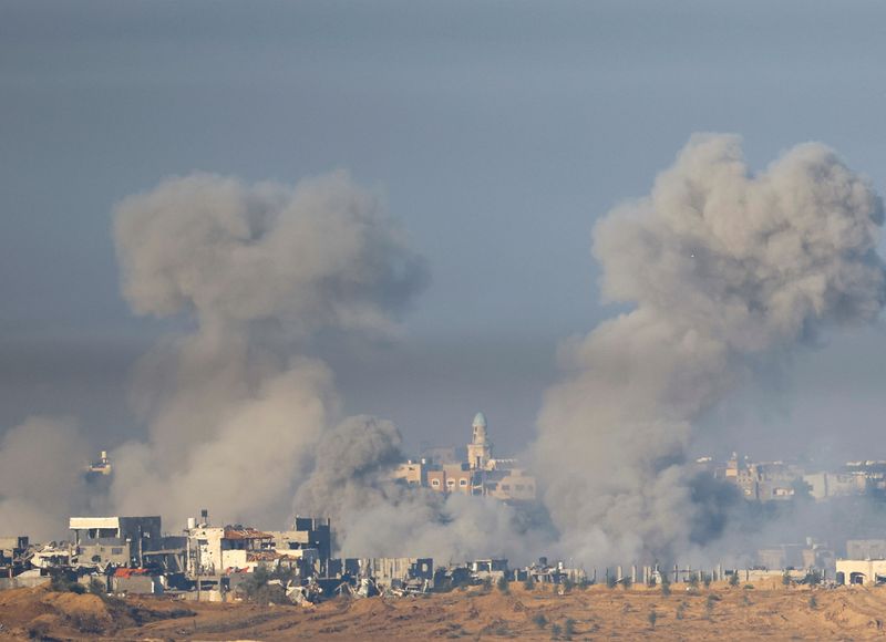 Smoke from an explosion rises in Gaza, after a temporary truce between Israel and the Palestinian Islamist group Hamas expired, as seen from southern Israel, December 3, 2023. REUTERS/Alexander Ermochenko