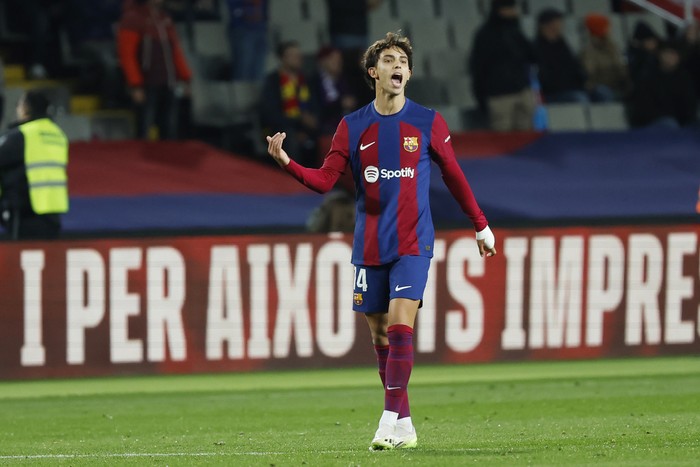 Barcelonas Joao Felix celebrates after scoring the opening goal during the Spanish La Liga soccer match between Barcelona and Atletico Madrid at the Olimpic Lluis Companys stadium in Barcelona, Spain, Sunday, Dec. 3, 2023. (AP Photo/Joan Monfort)