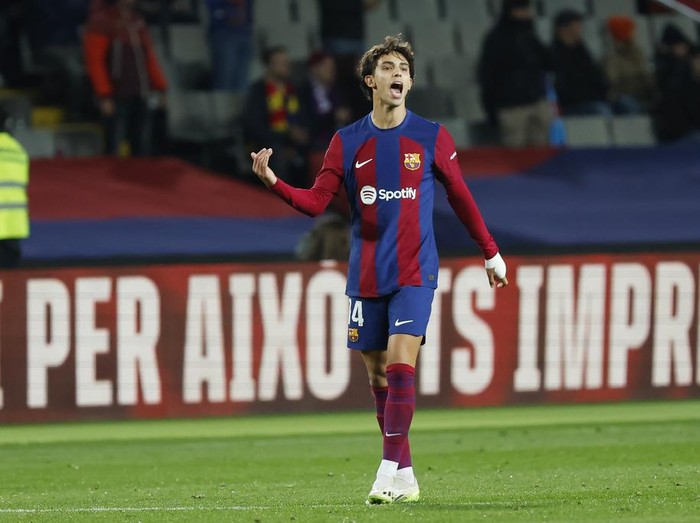 Barcelonas Joao Felix celebrates after scoring the opening goal during the Spanish La Liga soccer match between Barcelona and Atletico Madrid at the Olimpic Lluis Companys stadium in Barcelona, Spain, Sunday, Dec. 3, 2023. (AP Photo/Joan Monfort)