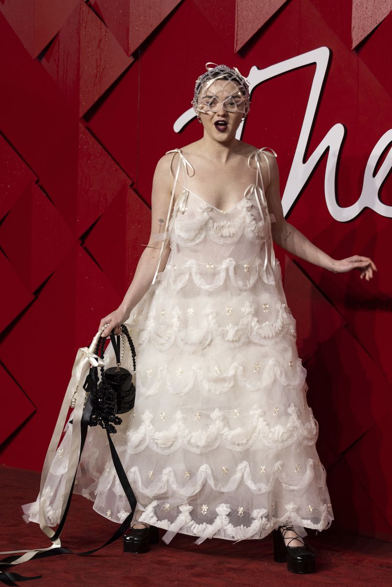 Maisie Williams poses for photographers upon arrival at the British Fashion Awards on Monday, Dec.  4, 2023 in London.  (Vianney Le Caer/Invision/AP)