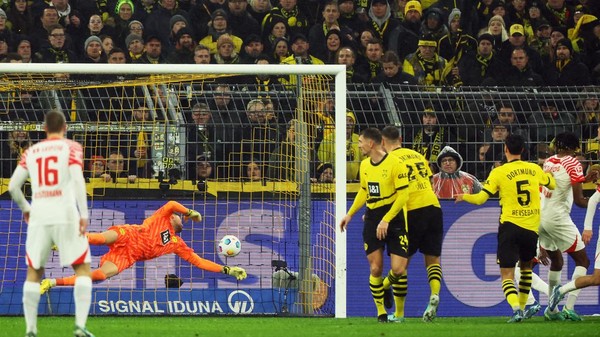 Soccer Football - Bundesliga - Borussia Dortmund v RB Leipzig - Signal Iduna Park, Dortmund, Germany - December 9, 2023 Borussia Dortmunds Ramy Bensebaini scores an own goal and RB Leipzig first goal REUTERS/Wolfgang Rattay DFL REGULATIONS PROHIBIT ANY USE OF PHOTOGRAPHS AS IMAGE SEQUENCES AND/OR QUASI-VIDEO.