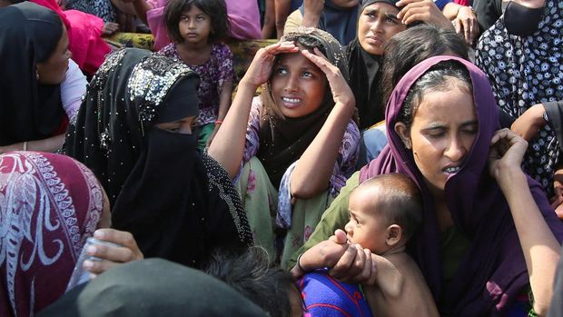 Rohingya Muslims rest on a beach after they land in Blang Raya, Pidie, Aceh province, Indonesia, December 10, 2023. REUTERS/Stringer NO RESALES. NO ARCHIVES