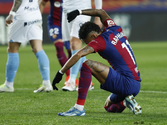 Barcelona's Raphinha reacts during the Spanish La Liga soccer match between Barcelona and Girona at the Olimpic Lluis Companys stadium in Barcelona, Spain, Sunday, Dec. 10, 2023. (AP Photo/Joan Monfort)