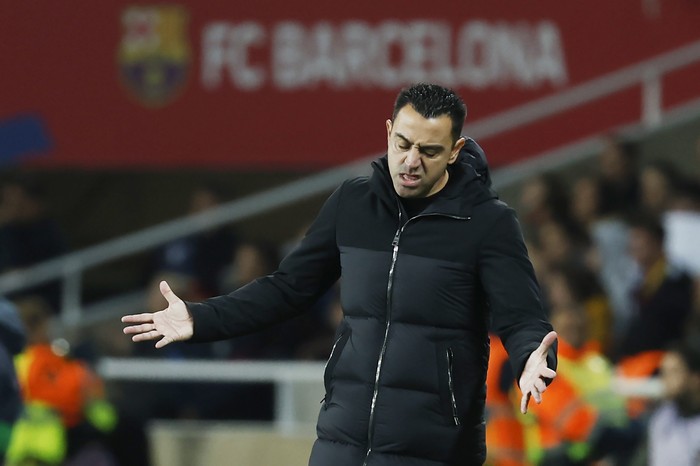 Barcelonas head coach Xavi Hernandez reacts during the Spanish La Liga soccer match between Barcelona and Girona at the Olimpic Lluis Companys stadium in Barcelona, Spain, Sunday, Dec. 10, 2023. (AP Photo/Joan Monfort)