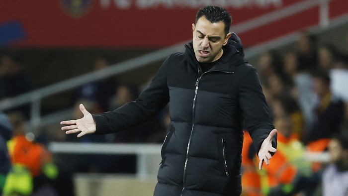Barcelonas head coach Xavi Hernandez reacts during the Spanish La Liga soccer match between Barcelona and Girona at the Olimpic Lluis Companys stadium in Barcelona, Spain, Sunday, Dec. 10, 2023. (AP Photo/Joan Monfort)