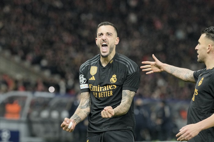 Real Madrid's Joselu celebrates after scoring his side's second goal during the Champions League group C soccer match between Union Berlin and Real Madrid at the Olympiastadion in Berlin, Tuesday, Dec. 12, 2023. (AP Photo/Markus Schreiber)