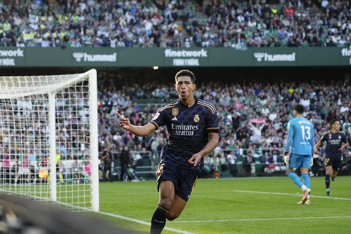 Real Madrids Jude Bellingham celebrates after scoring the opening goal during a Spanish La Liga soccer match between Betis and Real Madrid at the Benito Villamarin stadium in Seville, Spain, Saturday, Dec. 9, 2023. (AP Photo/Jose Breton)