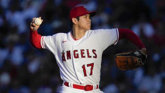 FILE - Los Angeles Angels starting pitcher Shohei Ohtani throws during a baseball game against the Los Angeles Dodgers in Anaheim, Calif., June 21, 2023. Ohtani agreed Saturday, Dec. 9, to a record $700 million, 10-year contract with the Dodgers. (AP Photo/Ashley Landis, File)