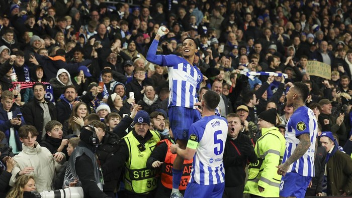 Brightons Joao Pedro, top, celebrates scoring his sides opening goal during the Europa League Group B soccer match between Brighton and Hove Albion and Olympique de Marseille at the Amex stadium in Brighton, England, Thursday, Dec. 14, 2023. (AP Photo/Ian Walton)