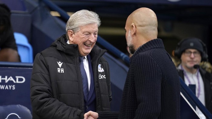 Manchester Citys head coach Pep Guardiola, right, greets Crystal Palaces head coach Roy Hodgson ahead the English Premier League soccer match between Manchester City and Crystal Palace at the Etihad Stadium in Manchester, England, Saturday, Dec. 16, 2023. (AP Photo/Dave Thompson)