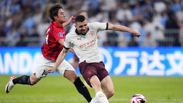 Manchester City's Mateo Kovacic scores his side's second goal during the Soccer Club World Cup semifinal soccer match between Urawa Reds and Manchester City FC at King Abdullah Sports City Stadium in Jeddah, Saudi Arabia, Tuesday, Dec. 19, 2023. (AP Photo/Manu Fernandez)