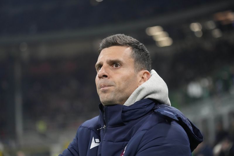 Bologna's Michel Aebischer, left, and Bologna's Nikola Moro celebrate at the end of the Italian Cup round of 16 soccer match between Inter Milan and Bologna, at the San Siro stadium in Milan, Italy, Wednesday, Dec. 20, 2023. (AP Photo/Luca Bruno)