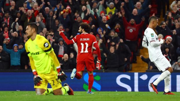 Soccer Football - Carabao Cup - Quarter Final - Liverpool v West Ham United - Anfield, Liverpool, Britain - December 20, 2023 Liverpool's Mohamed Salah celebrates scoring their fourth goal REUTERS/Molly Darlington NO USE WITH UNAUTHORIZED AUDIO, VIDEO, DATA, FIXTURE LISTS, CLUB/LEAGUE LOGOS OR 'LIVE' SERVICES. ONLINE IN-MATCH USE LIMITED TO 45 IMAGES, NO VIDEO EMULATION. NO USE IN BETTING, GAMES OR SINGLE CLUB/LEAGUE/PLAYER PUBLICATIONS.