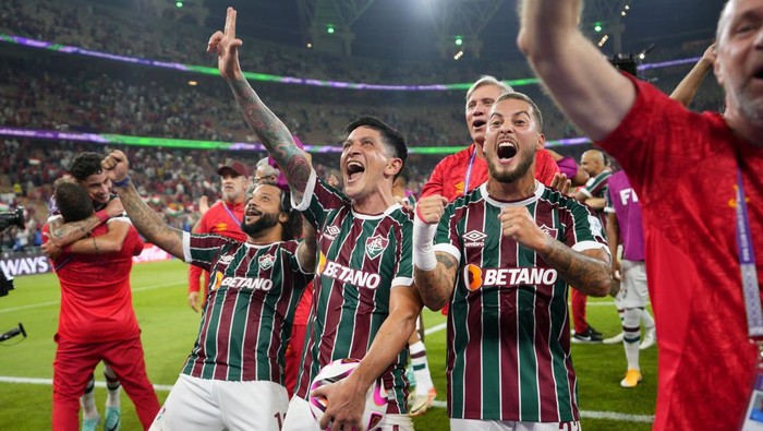 Fluminenses Marcelo, German Cano and Guga, from left, celebrate at the end of the Soccer Club World Cup semifinal soccer match between Fluminense FC and Al Ahly FC at King Abdullah Sports City Stadium in Jeddah, Saudi Arabia, Monday, Dec. 18, 2023. Fluminense won 2-0. (AP Photo/Manu Fernandez)