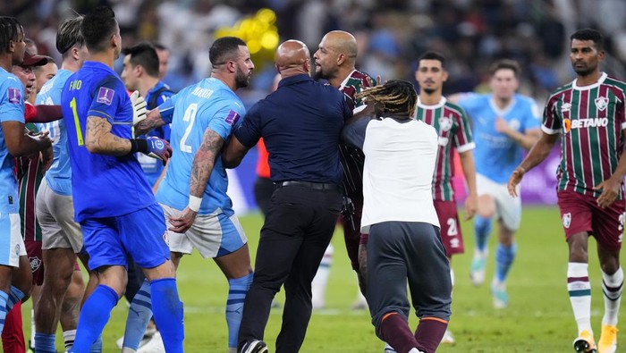 Manchester Citys Kyle Walker, center left, and Fluminenses Felipe Melo, center right, argue at the end of the Soccer Club World Cup final match between Manchester City FC and Fluminense FC at King Abdullah Sports City Stadium in Jeddah, Saudi Arabia, Friday, Dec. 22, 2023. Manchester City won 4-0. (AP Photo/Manu Fernandez)