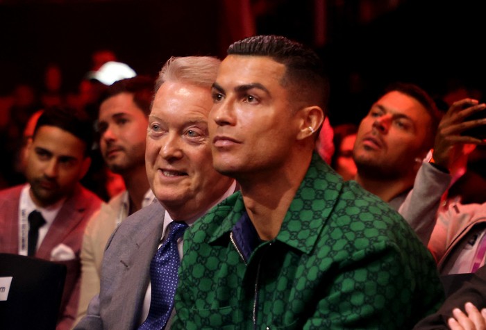 Boxing - Anthony Joshua v Otto Wallin - Kingdom Arena, Riyadh, Saudi Arabia - December 23, 2023 Frank Warren and Cristiano Ronaldo are seen in the stands before the fight REUTERS/Ahmed Yosri