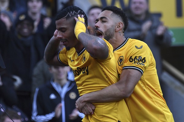 Wolverhampton Wanderers Mario Lemina, 3rd from right, scores his sides first goal during the English Premier League soccer match between Wolverhampton Wanderers and Chelsea at Molineux stadium in Wolverhampton, England, Sunday, Dec. 24, 2023. (Jacob King/PA via AP)