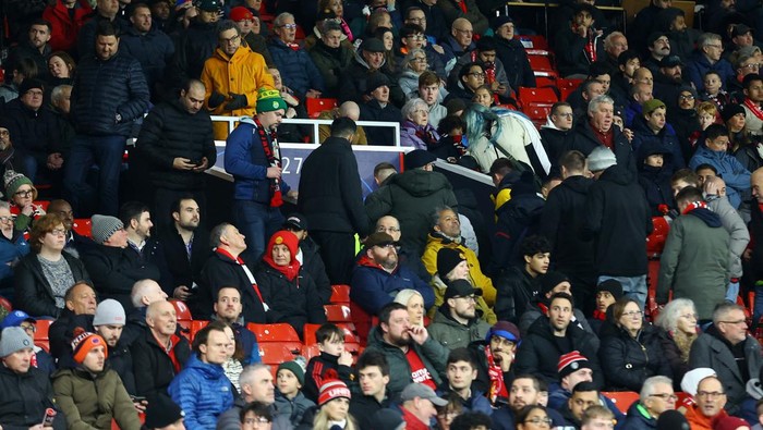 Soccer Football - Champions League - Group A - Manchester United v Bayern Munich - Old Trafford, Manchester, Britain - December 12, 2023 Manchester United fans are seen leaving the stadium during the match REUTERS/Carl Recine