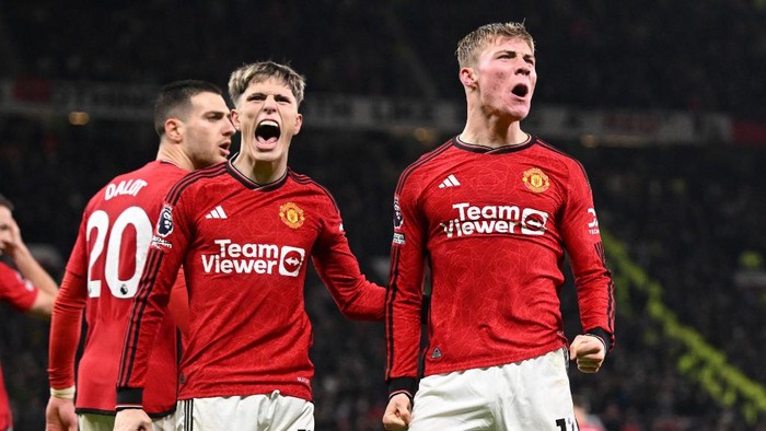 Manchester Uniteds Danish striker #11 Rasmus Hojlund (R) celebrates with Manchester Uniteds Argentinian midfielder #17 Alejandro Garnacho (L) after scoring their third goal during the English Premier League football match between Manchester United and Aston Villa at Old Trafford in Manchester, north west England, on December 26, 2023. (Photo by Oli SCARFF / AFP) / RESTRICTED TO EDITORIAL USE. No use with unauthorized audio, video, data, fixture lists, club/league logos or live services. Online in-match use limited to 120 images. An additional 40 images may be used in extra time. No video emulation. Social media in-match use limited to 120 images. An additional 40 images may be used in extra time. No use in betting publications, games or single club/league/player publications. /