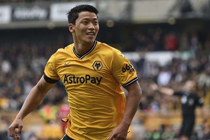 Wolverhampton Wanderers' Hwang Hee-chan celebrates after scoring his side's opening goal during the English Premier League soccer match between Wolverhampton and Liverpool at the Molineux stadium in Wolverhampton, England, Saturday, Sept. 16, 2023. (AP Photo/Rui Vieira)