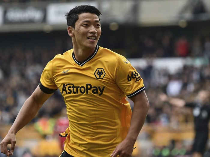 Wolverhampton Wanderers' Hwang Hee-chan celebrates after scoring his side's opening goal during the English Premier League soccer match between Wolverhampton and Liverpool at the Molineux stadium in Wolverhampton, England, Saturday, Sept. 16, 2023. (AP Photo/Rui Vieira)